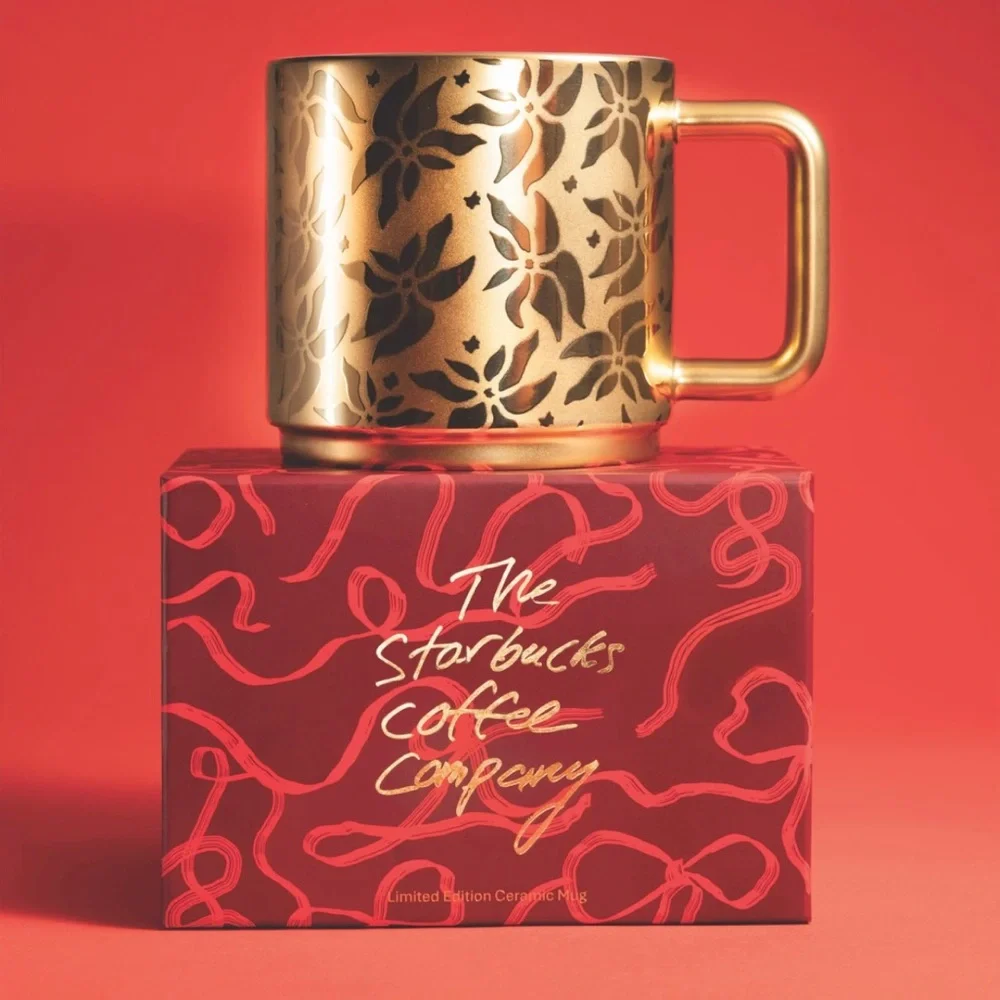 2025 Starbucks, gold poinsettia coffee cup. New with box.